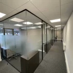 Office-space-design-with-framed-glass-door-glass--partitions-screen