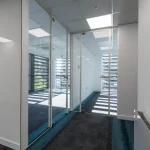 Office-space-design-with-framed-glass-door-glass-partitions-screen-2