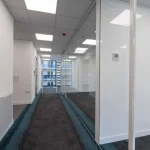 Office-space-design-with-framed-glass-door-glass-partitions-screen-5