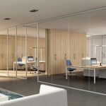 Modern office with solid partitions improving privacy and workspace layout